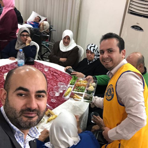 Dr. Hassan Tajideen Participating with the Elderly in their Feast