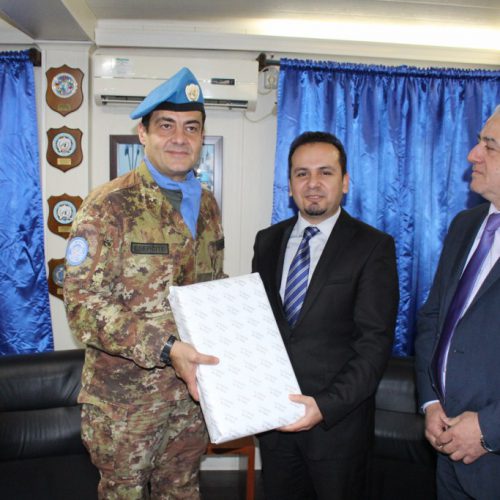 Dr. Hassan Tajideen receiving an Honor Shield from the West Sector – UNIFEL