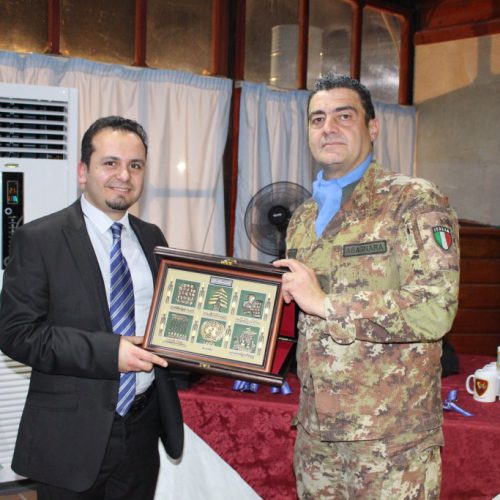 Dr. Hassan Tajideen receiving an Honor Shield from the West Sector – UNIFEL