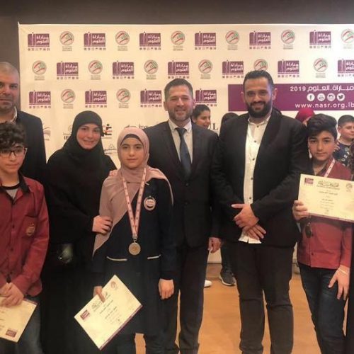 Dr. Hassan Tajideen Celebrating with Stars College Students the joy of success in accomplishing the second ranking in National Science Competition organized by the National Association for Research and Science